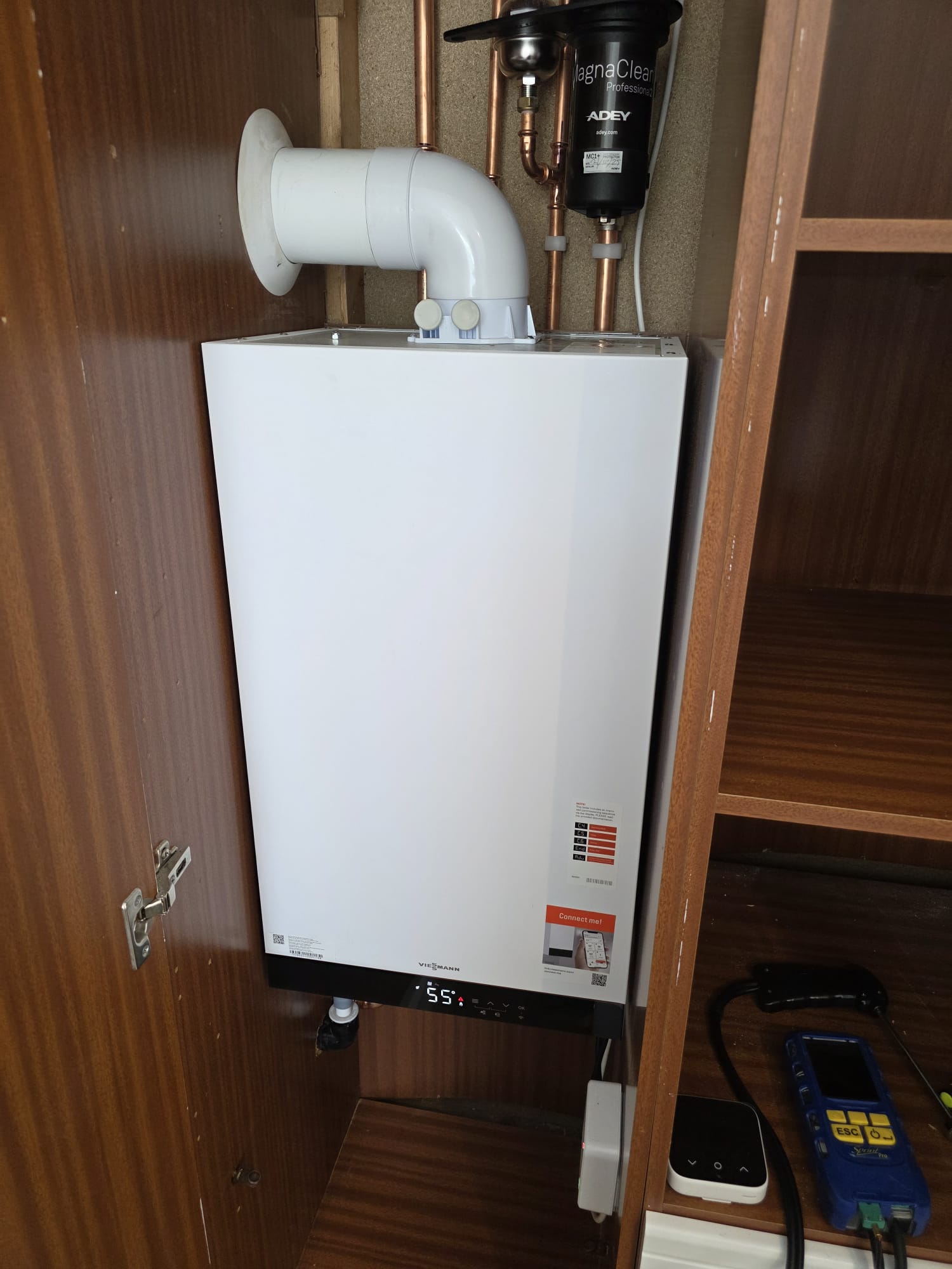Gas Safe boiler repair on a Viessmann combi boiler in a Surrey airing cupboard