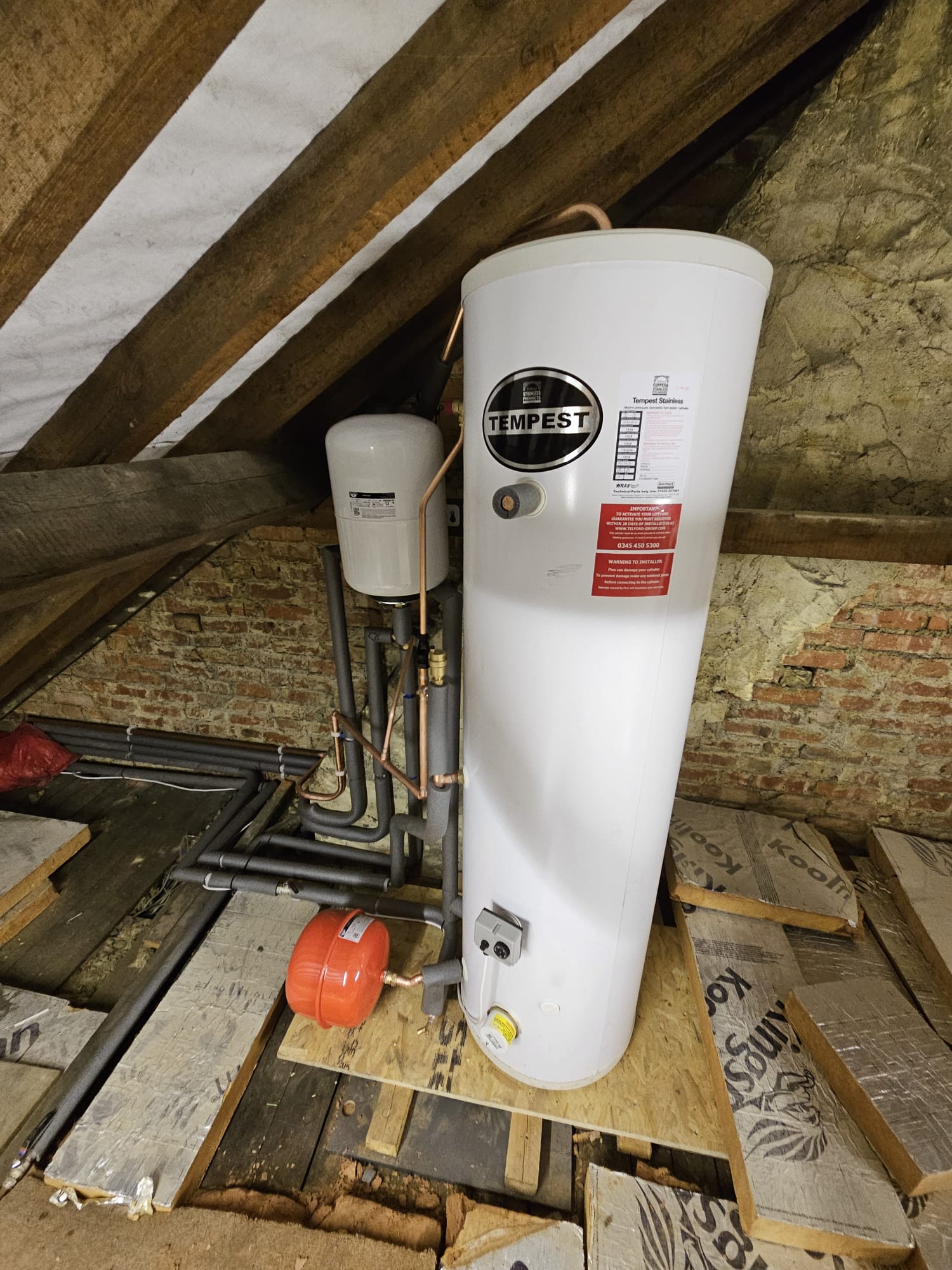 Loft-installed Tempest unvented cylinder with expansion vessels, Surrey